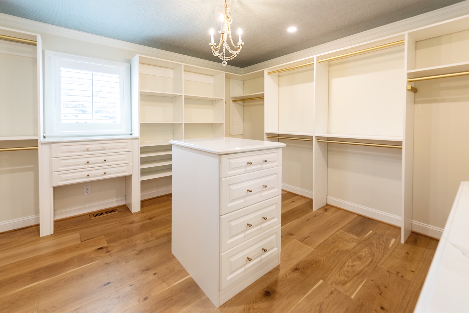 Walk-in closet countertop in Calacatta Gold finish