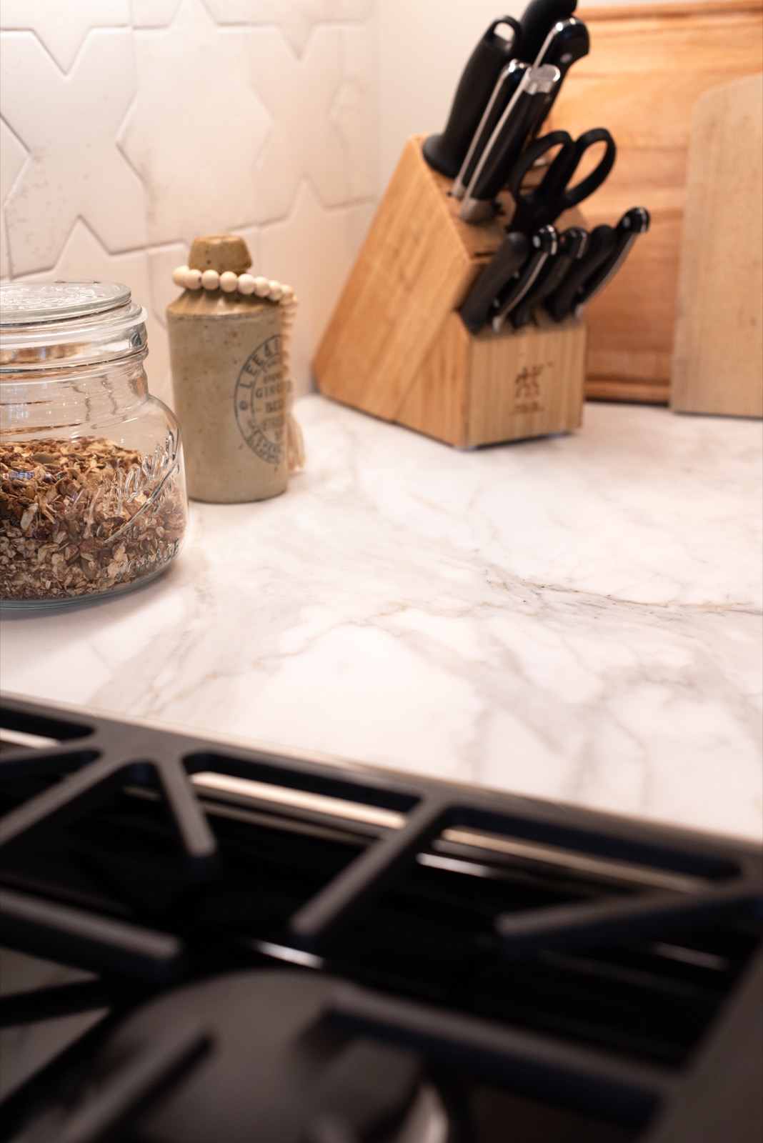 Kitchen range detail with Calacatta Crema marble countertops